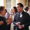 Two men talking and networking at a conference