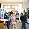 Conference attendees networking during a break