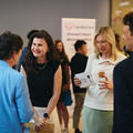 event attendees smiling and chatting